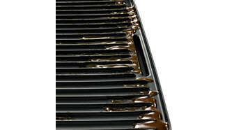 Sloped grill to drain excess fat away