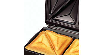 Плочите за изрязани и запечатани сандвичи запечатват продуктите/кашкавала във вътрешността на сандвича