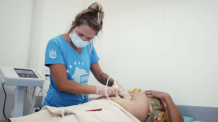Nurse performing a routine checkup in rural Brazil