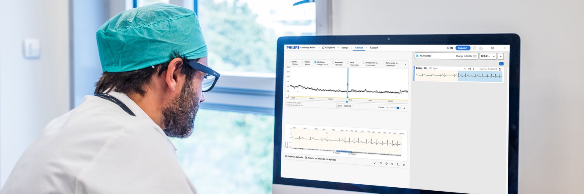 Clinician reviews Philips Cardiologs Holter data on his computer.