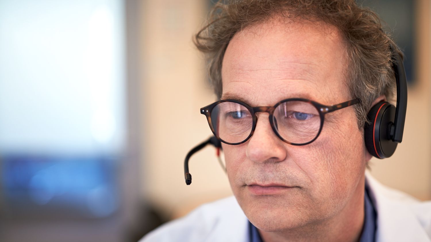 Pathologist looking at screen