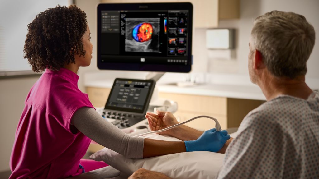 A nurse conducts an ultrasound exam