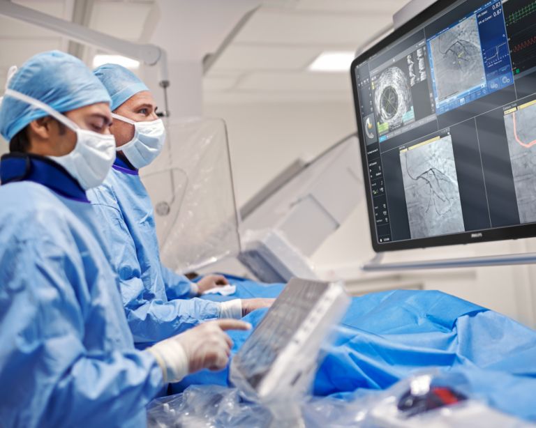  Clinicians perform an interventional procedure using the Azurion Image Guided Therapy system.