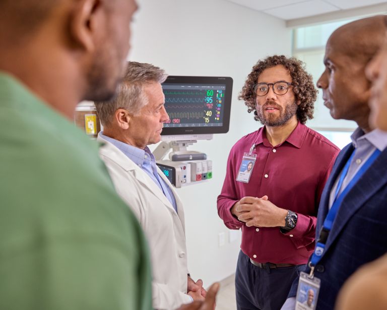 Philips representative training customers on MX patient monitor