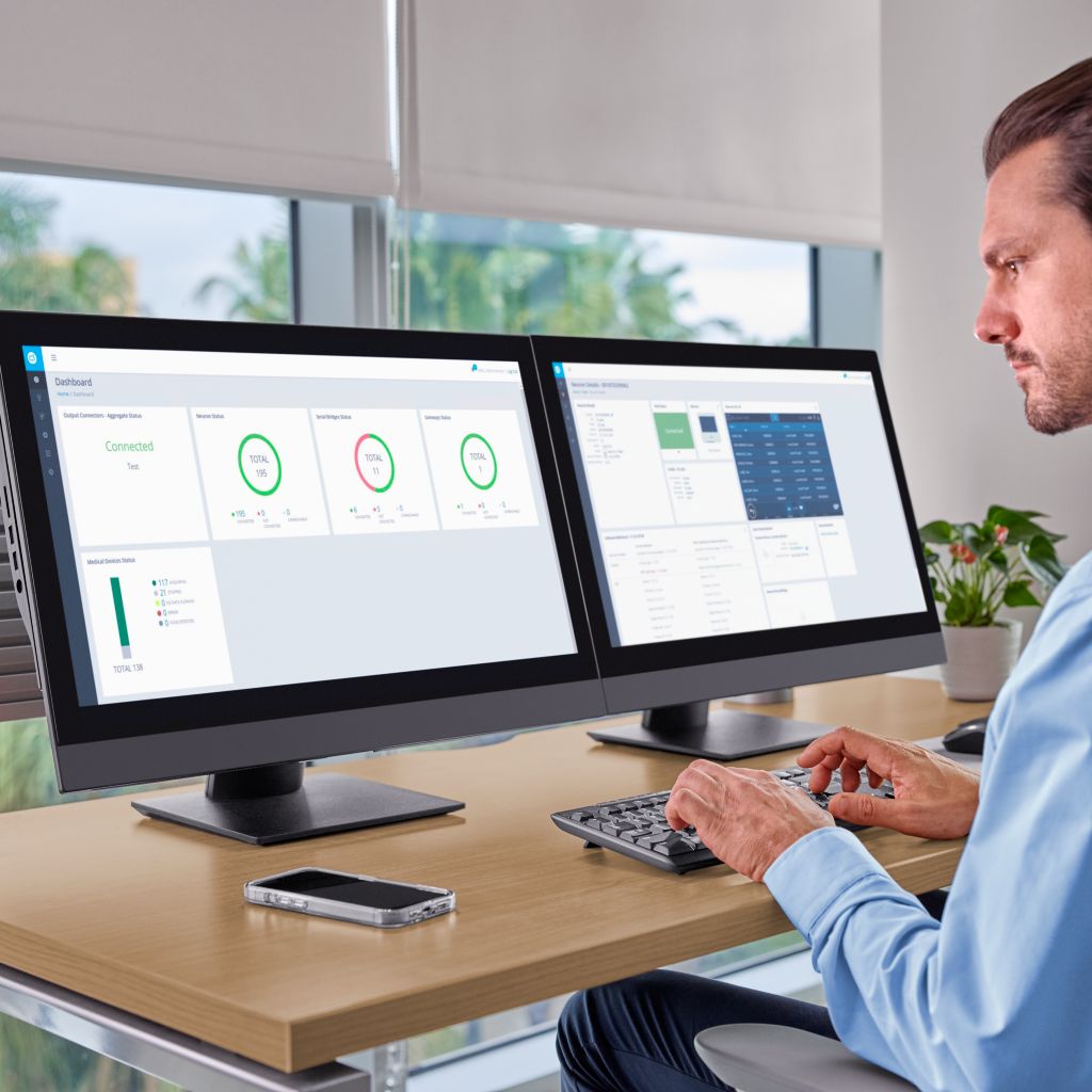 Clinician reviewing MDIP Dashboard and Neuron CX