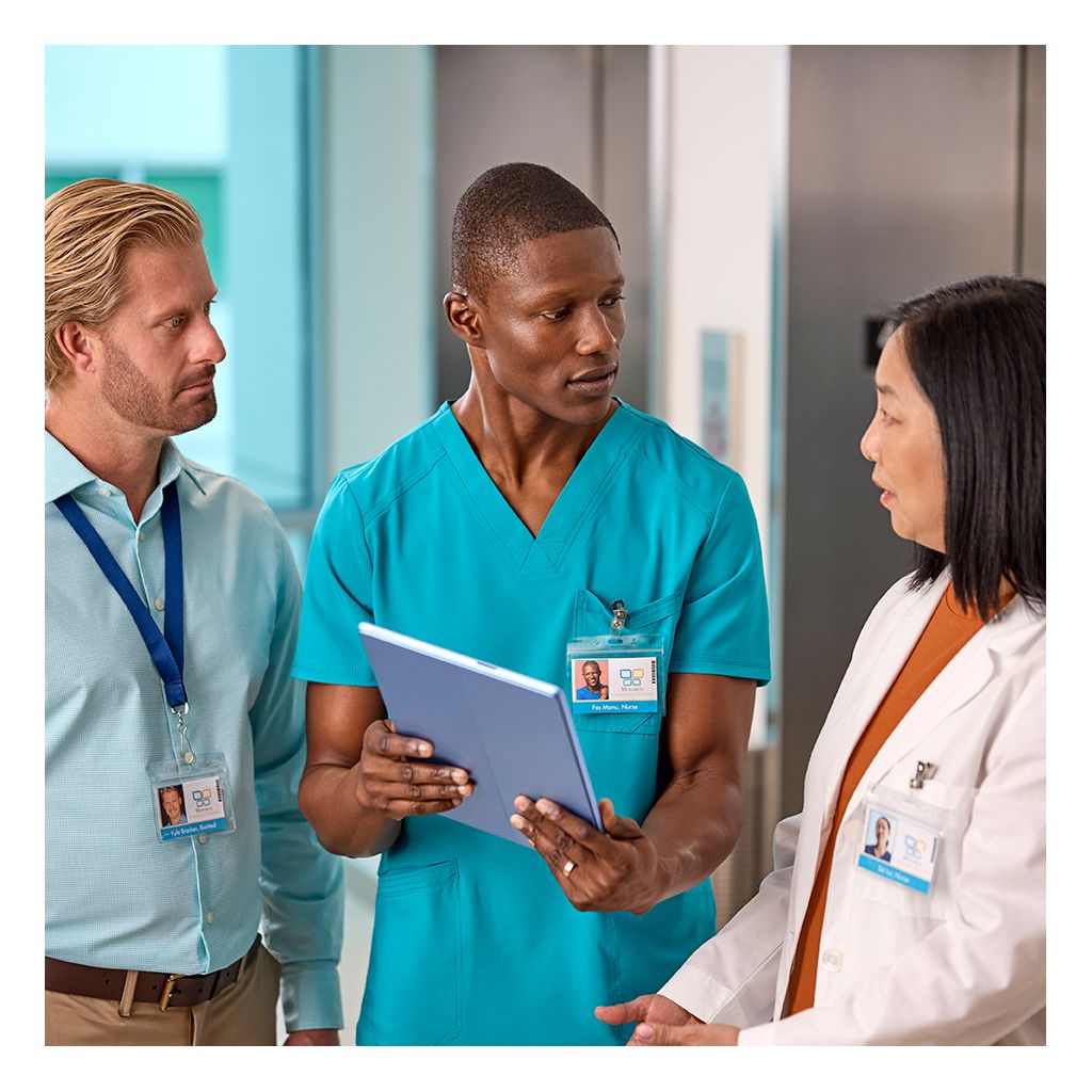 IT, nurse, doctor in hallway with tablet