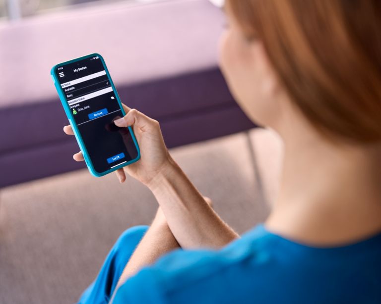 Nurse checking mobile phone 
