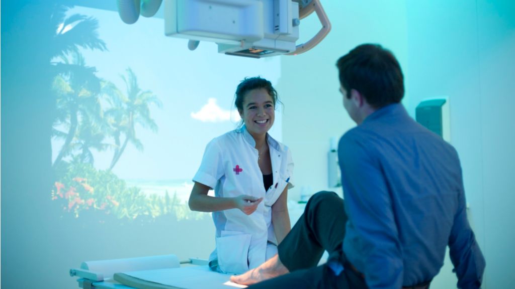 doctor and patient talking about his leg