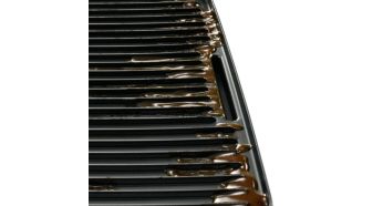 Sloped grill to drain excess fat away