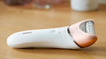 First epilator with S-shaped handle