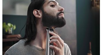 Металлический триммер точно моделирует бороду и подравнивает волосы на голове и теле
