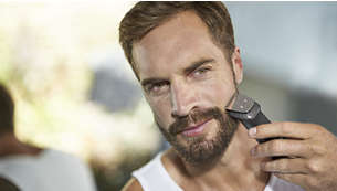 Металлический триммер точно подстригает бороду, волосы и тело