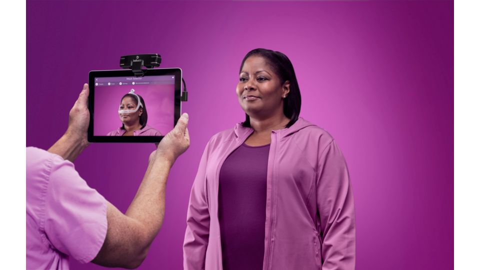 Woman using Philips Mask Selector 3D CPAP