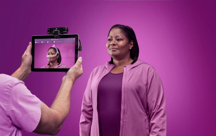 Woman using Philips Mask Selector 3D CPAP