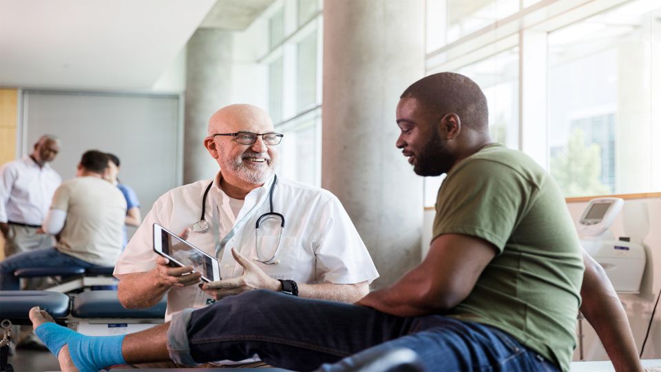 A clinician in consultation with a patient