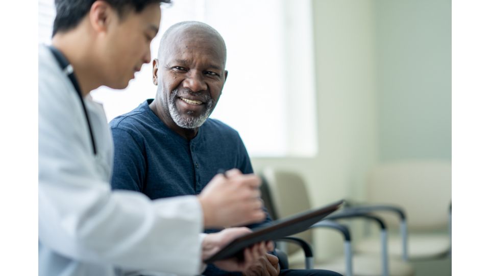 A healthcare professional and their patient in discussion