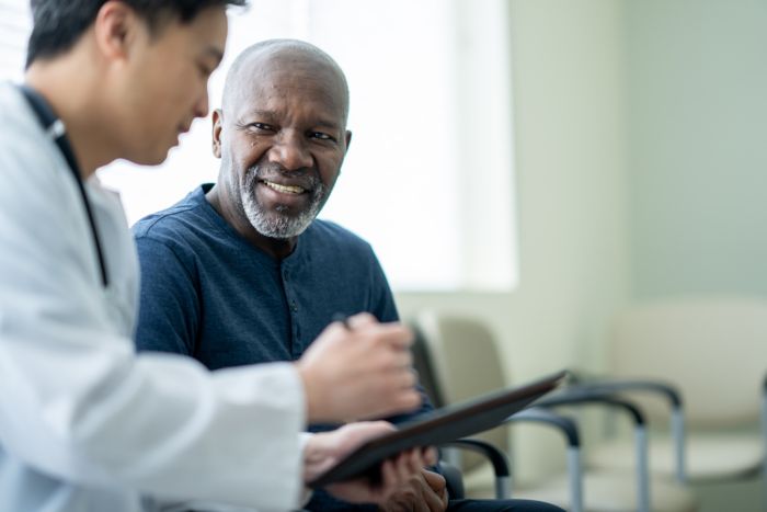 A healthcare professional and their patient in discussion
