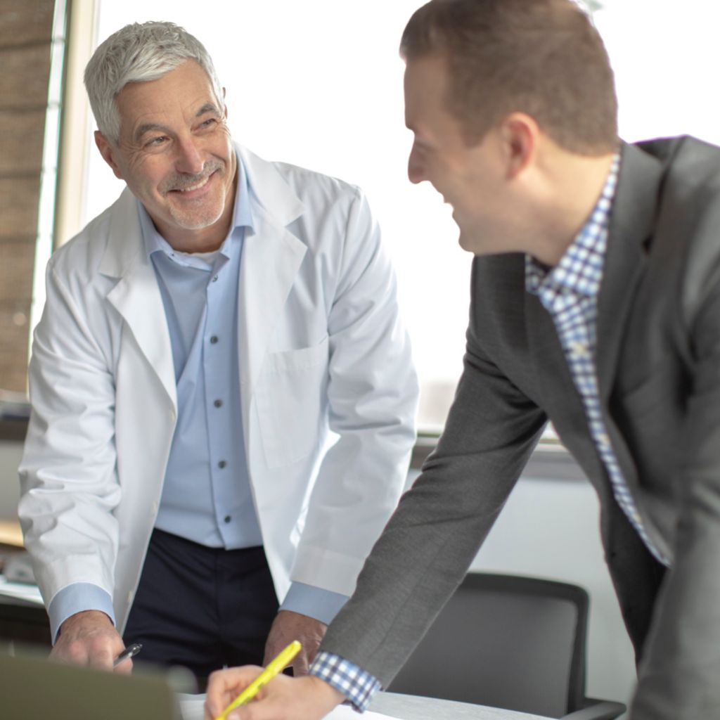 SymphonySuite OBL and ASC Customer Physician Conversation in Meeting Room
