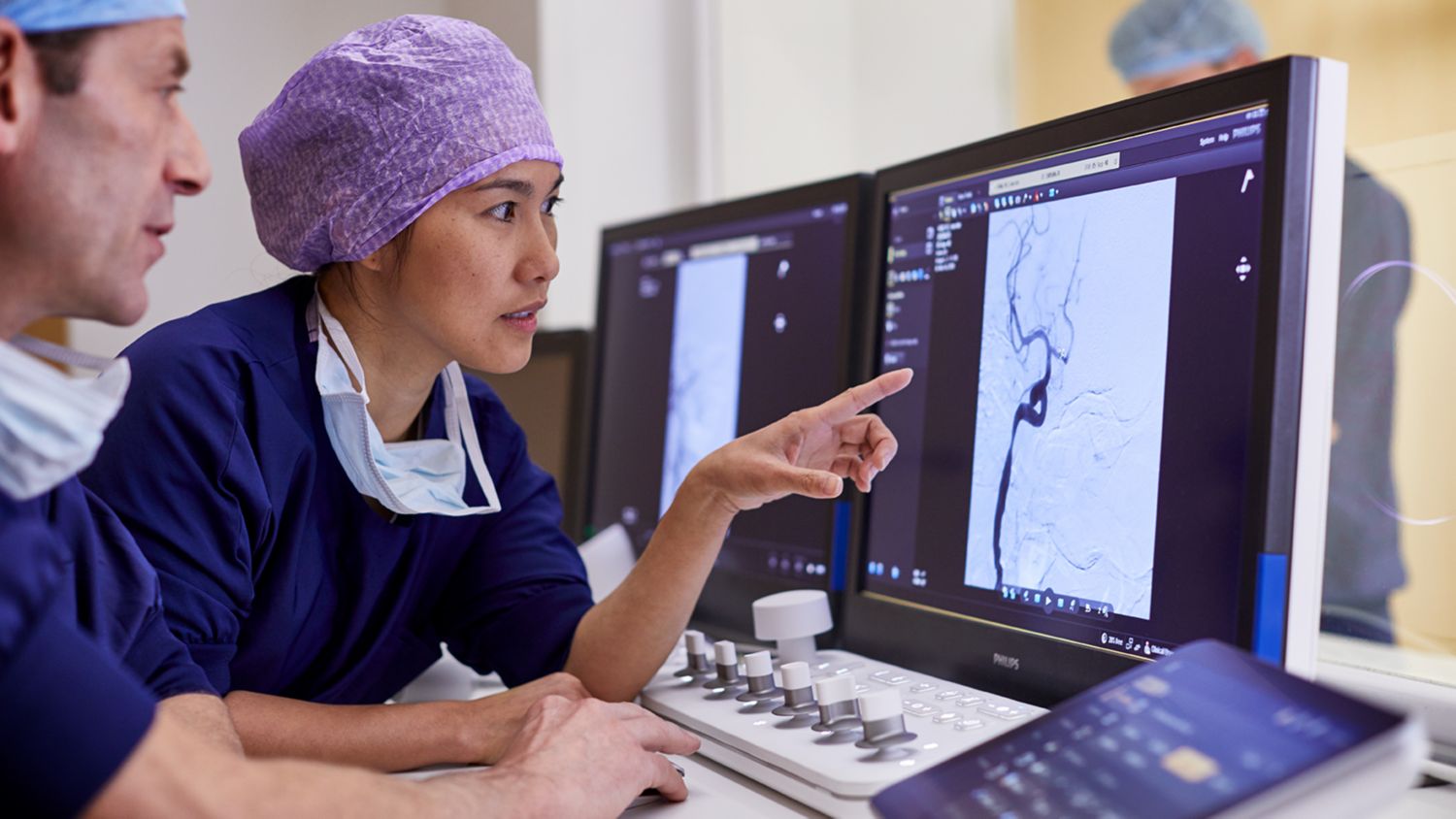 Hospital clinician looking at computer screen