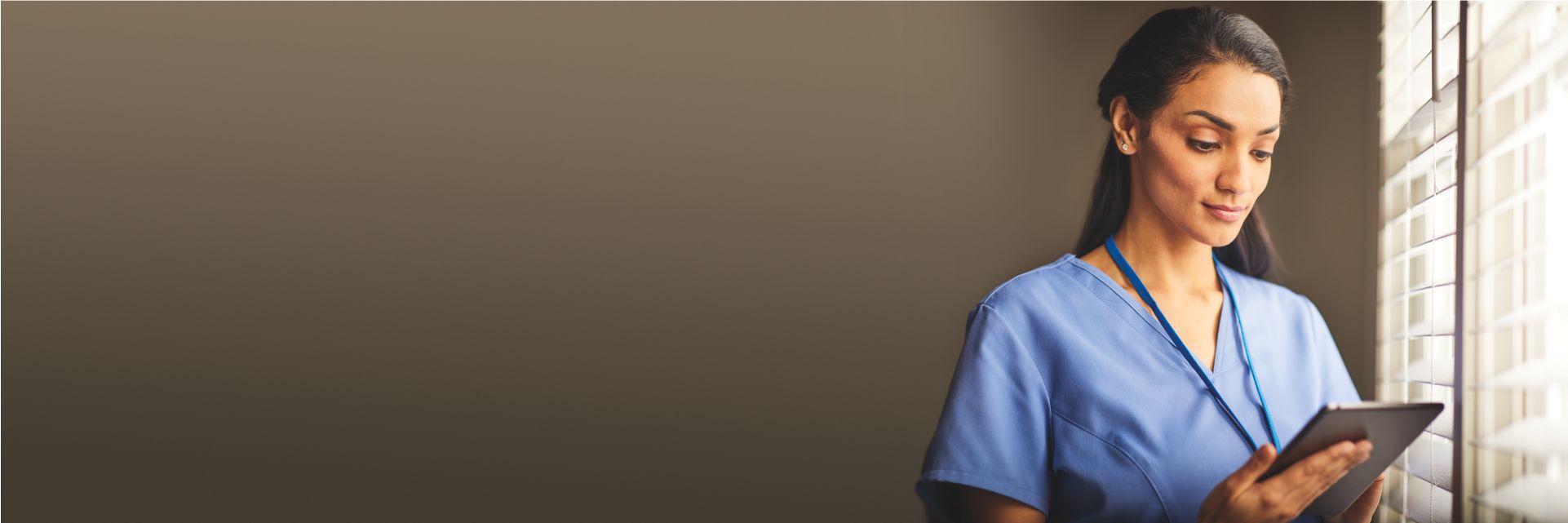 Clinician reviewing patient on data on tablet