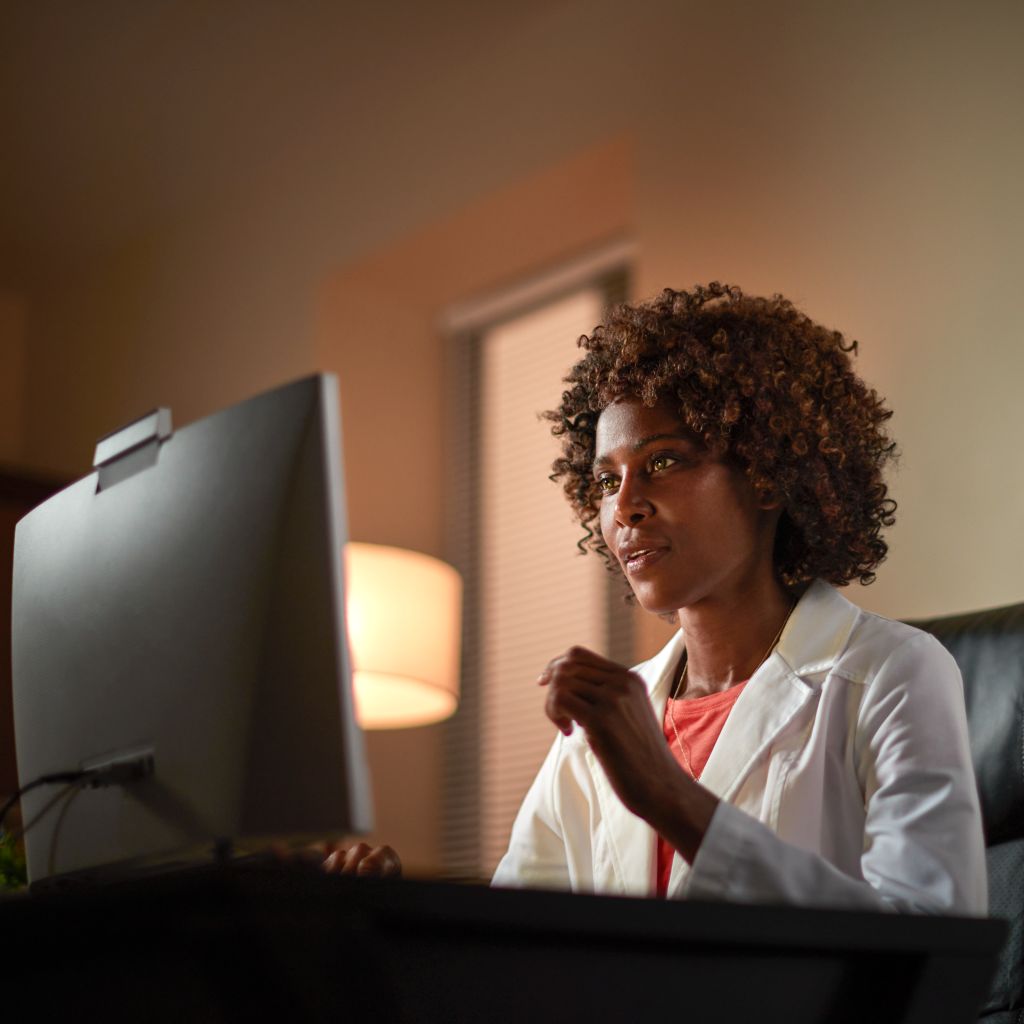 Healthcare professional looking at a screen