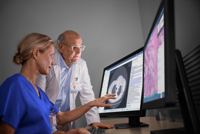 Oncologist and radiologist reviewing scans