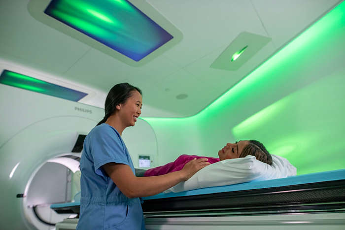 Philips Ambient CT7500 in use with a clinician and patient 