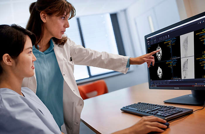 Radiologist reviewing scans