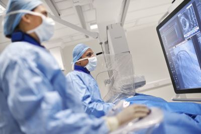 Interventional clinicians using Philips Azurion system during image-guided procedure