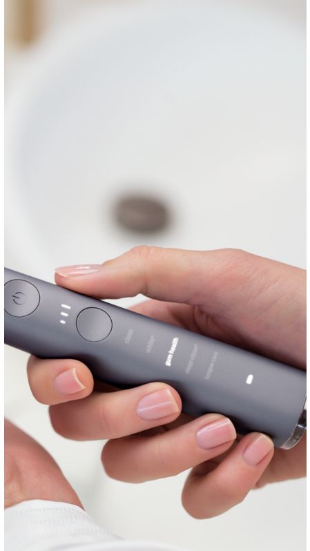 Hands holding a Philips Sonicare DiamondClean Smart