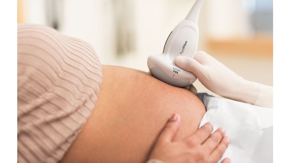 Pregnant woman getting ultrasound