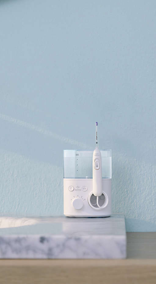 Philips Sonicare Power Flosser standing on a countertop