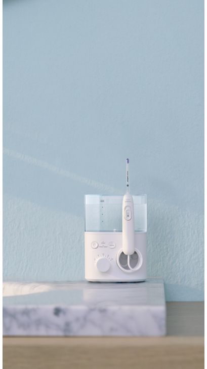 Philips Sonicare Power Flosser standing on a countertop