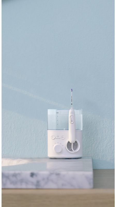 Philips Sonicare Power Flosser standing on a countertop