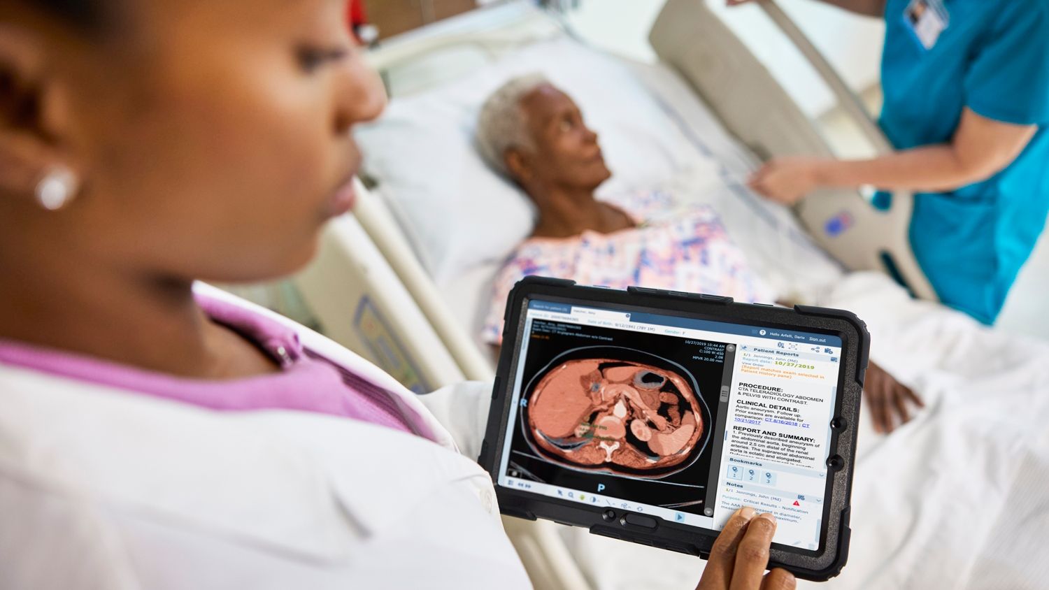 doctor looking at results on a tablet