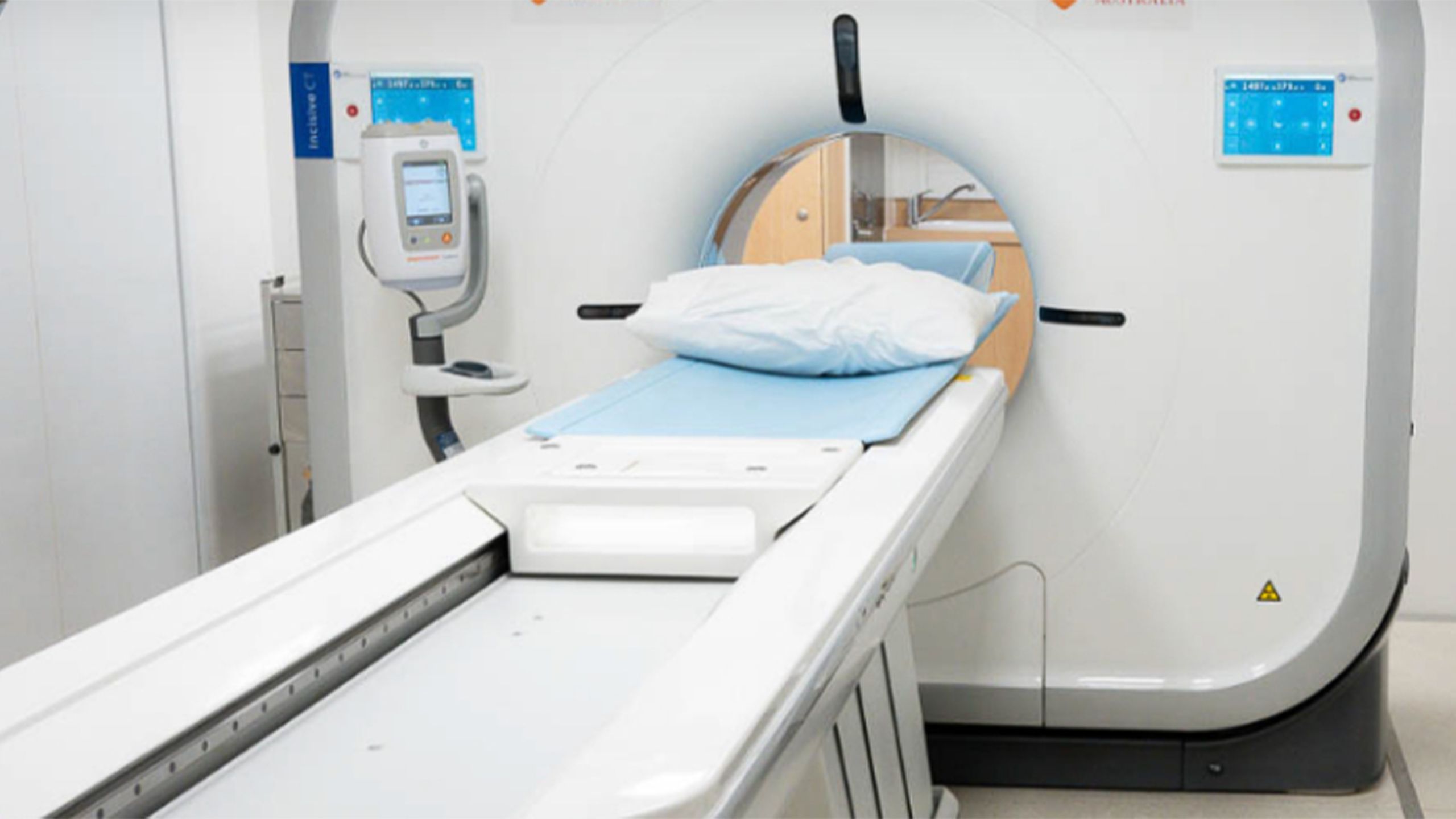 CT scanner with patient table prepared for diagnostic imaging