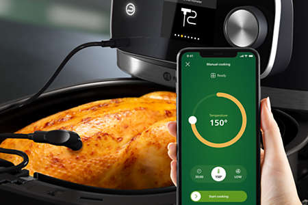 Wbudowany w airfryer Philips Ovi 2.0 termometr do gotowania pokazuje w aplikacji mobilnej dokłądną temperaturzę przygotowywanego mięsa, zapobiegając przypaleniu lub przesuszeniu i zapewniając mu soczystość podczas pieczenia.