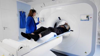 Patient undergoing CT scan with Philips CT 3500 system in radiology department