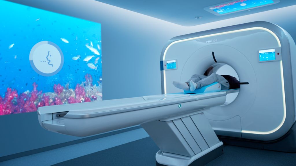 Patient lying in the bore head first in a CT Incisive in an exam room with Ambient Experience