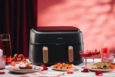 Dual basket airfryer displayed with prepared dinner