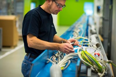 Philips employee working on a refurbished IGT system