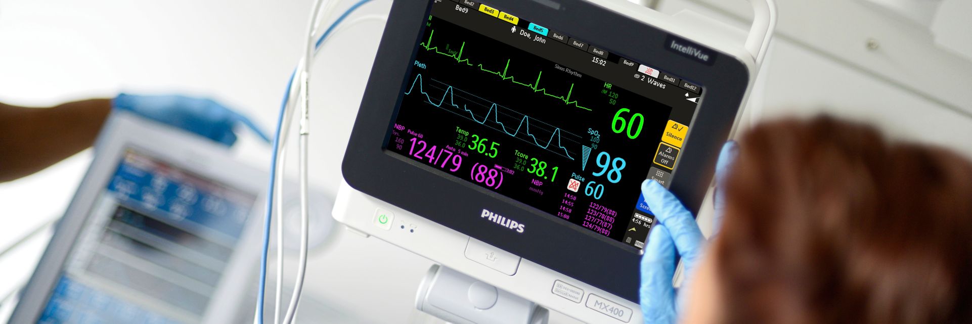 Clinician at an MX400 looking at vital signs