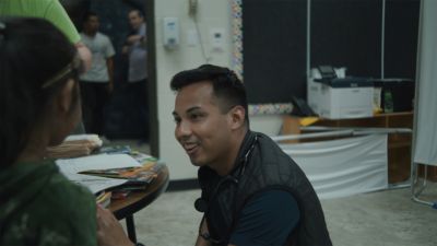 Clinician speaking with patient inside mobile clinic