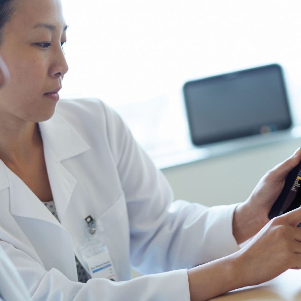 clinicial watching at tablet