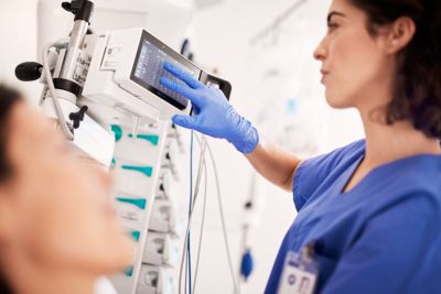 Nurse monitoring patient