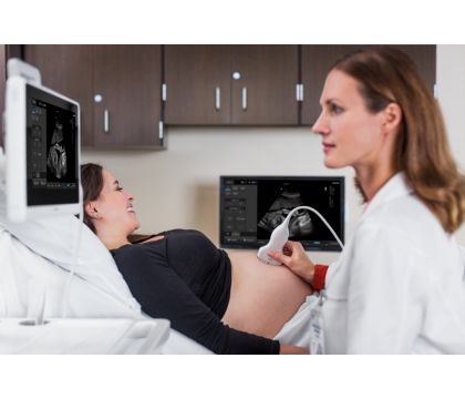 InnoSight in scanning room with doctor scanning OB patient with C6-2