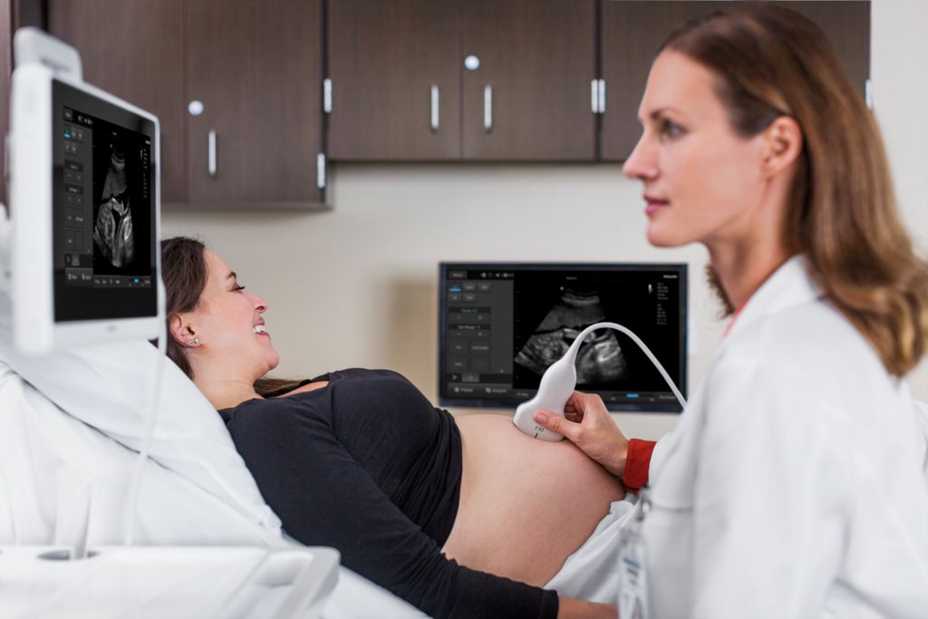InnoSight in scanning room with doctor scanning OB patient with C6-2