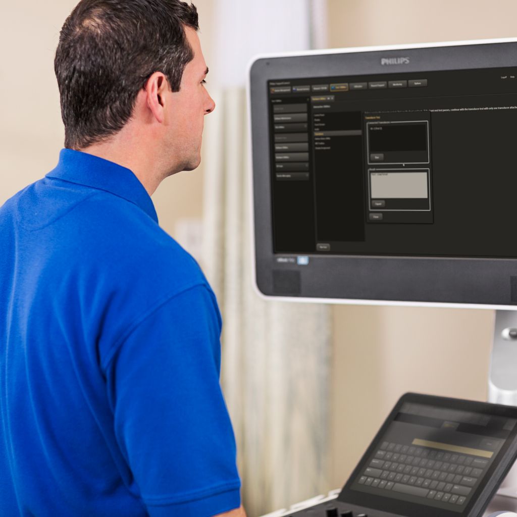 Field service engineer working on a laptop on remote service call