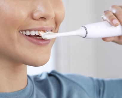 Patient brushing the front teeth.