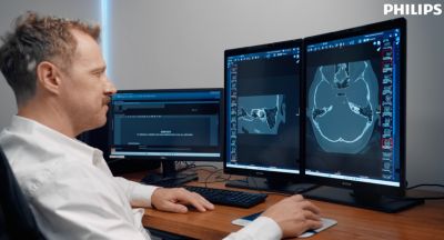 man looking at clinical image